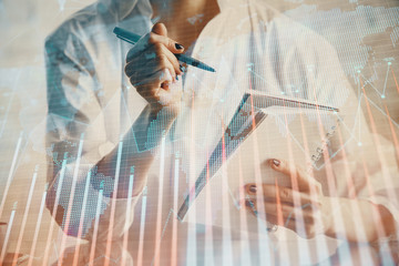 Financial chart drawn over hands taking notes background. Concept of research. Multi exposure