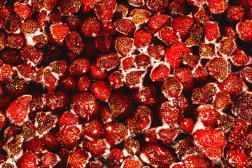 Strawberries are cooked in syrup