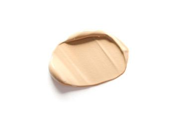 Beige makeup smear of creamy foundation isolated on white background. The concept of fashion and beauty industry. - Image
