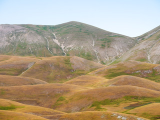 Castelluccio di Norcia, in Umbria, Italy. Rolling hills landscape. Popular tourist destination.