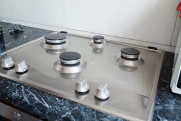 Perfectly clean gas cooker after being washed with polishing chemicals. The result of washing the burners.