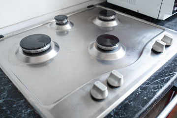 Perfectly clean gas cooker after being washed with polishing chemicals. The result of washing the burners.