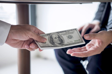 Dishonest cheating in business illegal money, Businessman receive bribe money under table to...