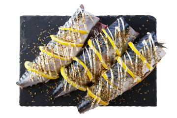 Fresh mackerel with spices and lemon ready for barbecue
