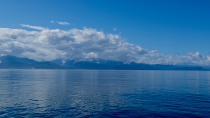 blue sky and sea and mountains