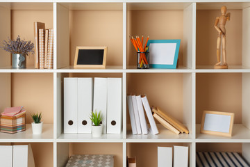 Home office working space. white shelf with accessories