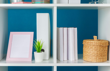 Obraz na płótnie Canvas Home office working space. white shelf with accessories
