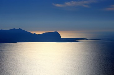 evocative image of coast on the sea at sunset in Sicily, Italy
