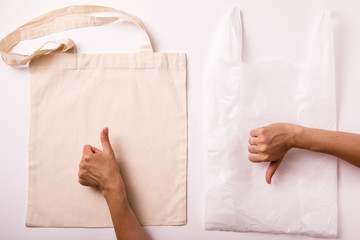 Canvas cotton shopping eco friendly bag over white background. Zero waste, plastic free concept. Top view, flat lay