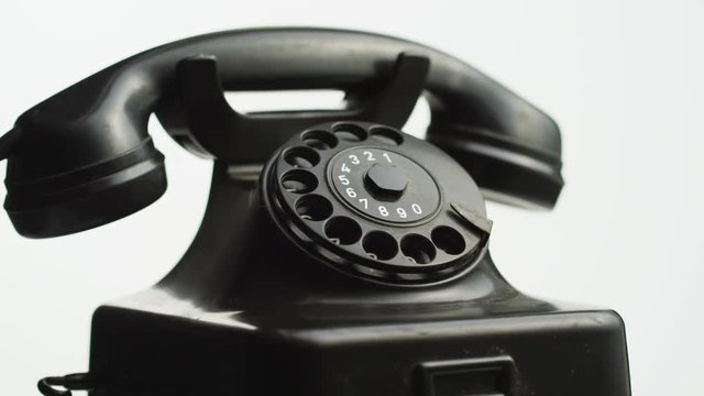 Black telephone on white background