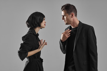 man and woman fighting over white background