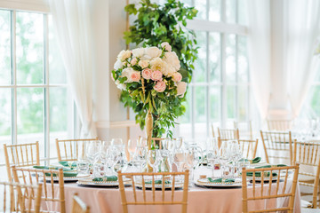 Luxury wedding table decoration. Special event table set up. Fresh flower decoration.