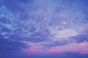Naklejka na ściany i meble Colorful cloudy sky at sunset.