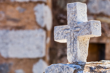 Greek stone cross on burial ground