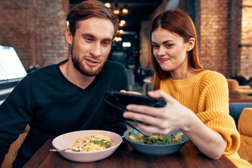 young couple having dinner in restaurant