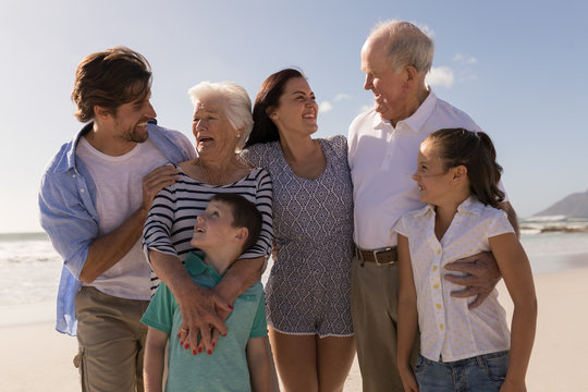 Family looking each other on beach