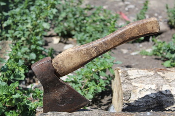 photo ax stuck in a log 