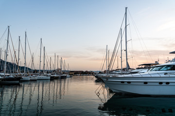 Plakat Luxury yachts moored in Marina at sunset