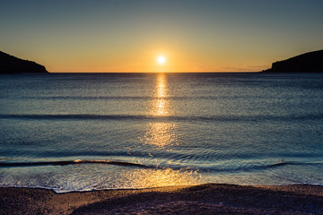 Sunset or sunrise over sea surface