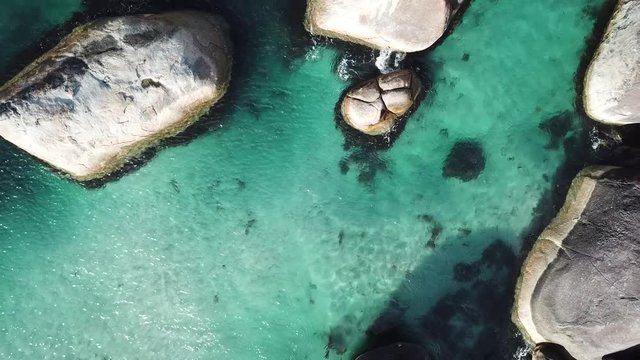 Aerial of tropical sea rock pools and boulders in Australia