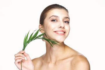 portrait of a beautiful woman with perfect skin looking at camera