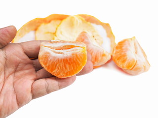 fresh peel ripe orange on hand isolated on white background.