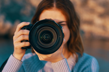 woman taking photo with digital camera