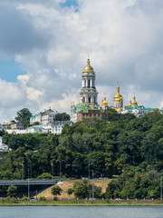 Fototapeta na wymiar View of Kyiv Pechersk Lavra monastery (Kiev Pechersk Lavra) and it’s bell tower (Great Belfry). Historical and cultural reserve – UNESCO object in Ukraine