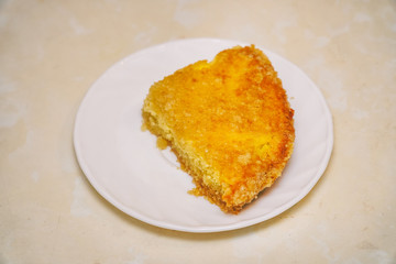 A piece of delicious cake on a white saucer