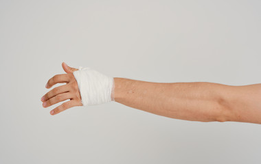 hand with adhesive bandage isolated on white