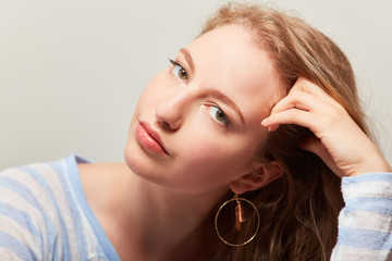 Sensual young woman with creole earrings