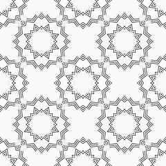 Abstract seamless stylized suns pattern. Ethnic geometrical ornament. Vector monochrome background.