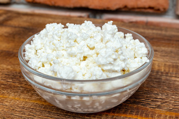 farm cottage cheese close up on wooden background protein healthy diet eco product