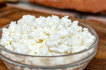 farm cottage cheese close up on wooden background protein healthy diet eco product
