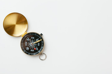 Golden vintage compass isolated on white background