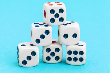 Gaming dices on blue background. Game concept.