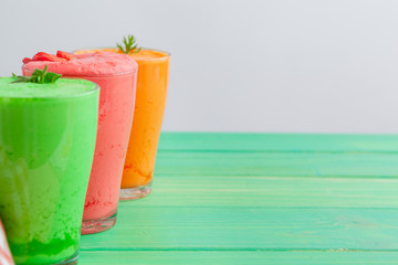 Row of healthy fresh fruit and vegetable smoothies