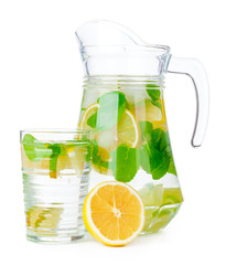Jug of homemade lemonade isolated on white background