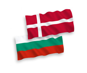National vector fabric wave flags of Bulgaria and Denmark isolated on white background. 1 to 2 proportion.