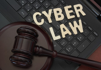 Cyber law and justice concept, judge gavel on computer keyboard