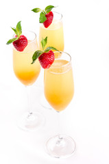 Glasses of wine and champagne with strawberry iIsolated on white background, close up. Party and holiday celebration. The buffet at the reception.