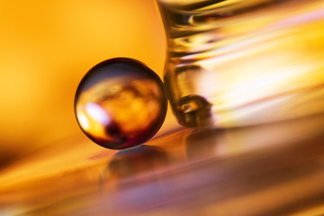 Small glass ball in abstract macro composition