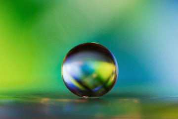 Small glass ball in abstract macro composition.