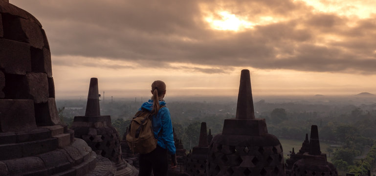 Tourist meets Sunrise at Borobudur temple in Java island,Indonesia.