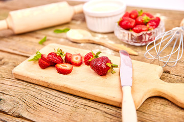 Strawberry on cutting board.  Raw ingredients for cooking strawberry pie