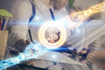 Cryptocurrency hologram over woman's hands writing background. Concept of blockchain. Double exposure