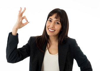 Portrait of a young beautiful smiling business woman doing O.K. sign. Isolated on white background