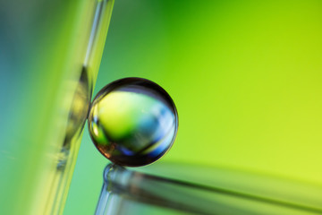 Small glass ball in abstract macro composition