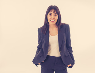 Portrait of a young beautiful and confident business woman smiling. Isolated on white background.