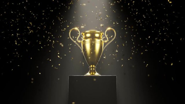 Golden metallic trophy cup on the platform. Award for a winner. Falling confetti
